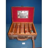 A Joseph Lang & Son brass mounted Oak and leather Cartridge-magazine containing spent cartridges,