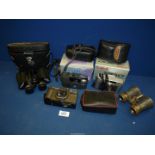 A pair of cased Boots Pacer binoculars, three cameras to include Canon Sure Shot Classic 120,