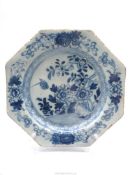 A good octagonal Delft plate painted with flowers and a bird, English or Irish (possibly Liverpool),