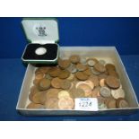 A quantity of English and foreign coins including pennies, half rupee,