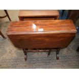 A Mahogany/Walnut Sutherland Table standing on turned legs/supports,