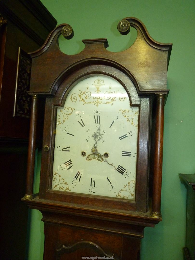A cross-banded Oak cased Longcase Clock having a painted face with Roman hour numerals and Arabic - Image 6 of 8