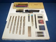 A quantity of Pens including an Osmiroid, German pen and pencil set with ink cartridges,