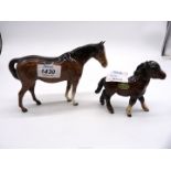 Two china ponies, one being Shetland Bay by Beswick and the other a Bay pony.