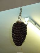 A ceiling light in the form of a bunch of grapes 13" long.