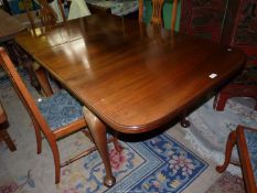 A good Satinwood pull-out extending Dining Table standing on heavy cabriole legs, 36'' x 41 1/2'',