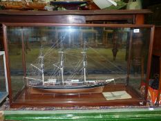 A glazed display case containing a model of The Cutty Sark, 40 1/2" wide x 16" deep x 24" high.