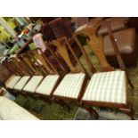 A set of six elegant Mahogany/Walnut framed Dining Chairs having elaborate Dutch style marquetry