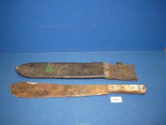 A WWI 1917 machete by Samuel Kitchin, Sheffield, wooden handle, (blade rusty), in leather sheath.