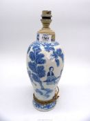An oriental lamp with four character mark to base in blue, 13½" tall.