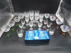A quantity of champagne coupe glasses with green stems, three Brierley wine glasses,