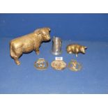 A very heavy brass Hereford Bull, pig and small quantity of horse brasses,