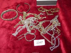 A quantity of chains and bracelets including; sprung wristlet marked Lambournes Birmingham 61,