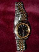 A Seiko Kinetic Gentleman's SQ100 Wristwatch with bi-metal wristlet,