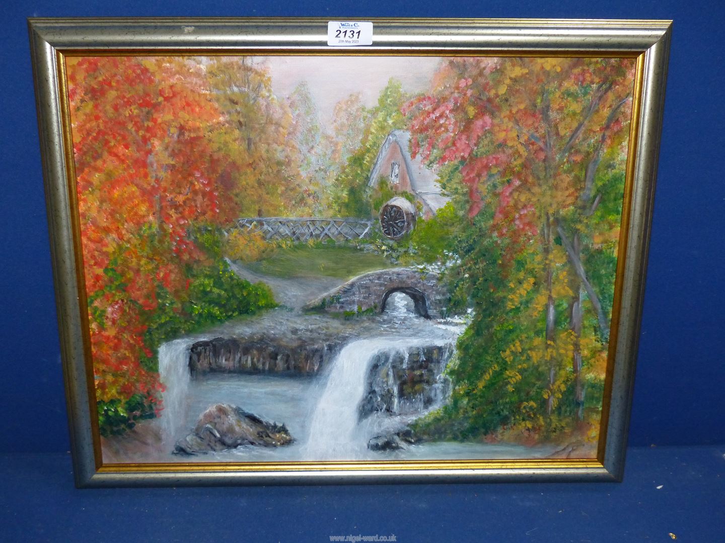 A framed Oil on canvas depicting a Water Mill, label verso 'Old Mill Stream' by Marjorie Lambeth.