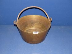 A brass preserving Pan with iron handle.