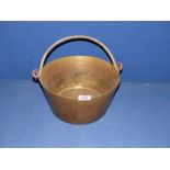 A brass preserving Pan with iron handle.