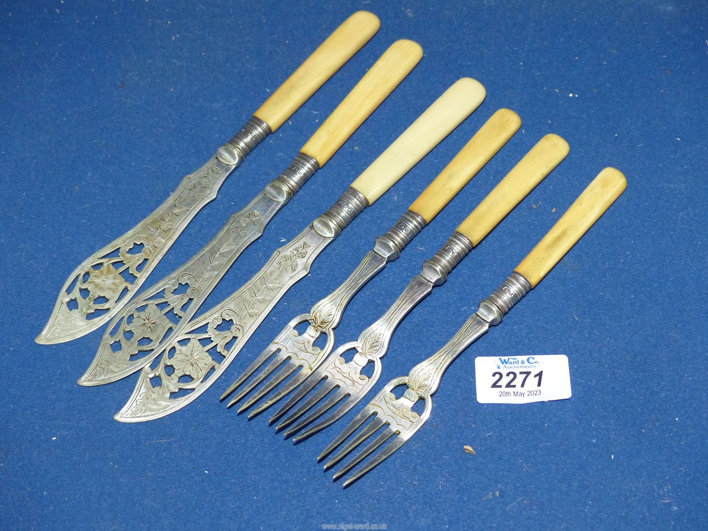 A set of three fish knives and forks having Sheffield silver collar and engraved and open pierced