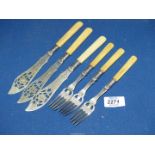 A set of three fish knives and forks having Sheffield silver collar and engraved and open pierced