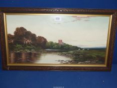 A carved wooden framed Oil painting depicting Sheep grazing by a river and a Church tower peering