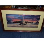 A wooden framed and mounted Print depicting a Boeing C-17, no visible signature, 39 1/2" x 22 1/2".