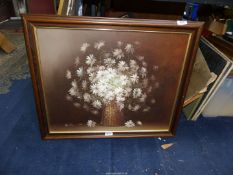 A wooden framed oil on canvas depicting a still life of flowers, signed lower left Austin,