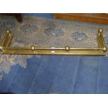 A brass fire kerb. 52" long x 15" deep.