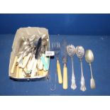 A quantity of cutlery including fish knives, serving spoons and forks, teaspoons,