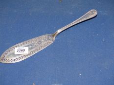 A silver cake server, London 1871, having pierced work and engraving to blade,