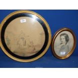 An oval framed Print of a young girl signed 'E.U.