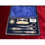 A boxed silver manicure set, Birmingham 1903, makers Adie and Lovekin.