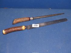 An antler handled carving knife and sharpening steel.