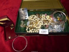 A quantity of costume jewellery including; bangles, ear studs, rings, etc.