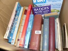 A box of books including 'Practical Clock Repairing', 'Badges of The British Army',