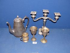 A small quantity of silver plate including a candelabra, two goblets and a beaker.