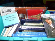 A box of books including 'And The Mountains Echoed' by Kaled Hosseini,