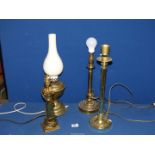 Three brass table lamps and an oil lamp converted to electric.