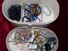 A quantity of costume jewellery including; bangles, beads, hair slides, etc.
