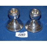 A pair of silver squat candlesticks, Birmingham 1970, makers mark for W.I.