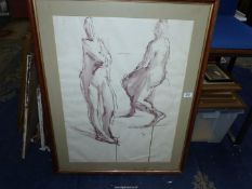 A large framed and mounted ink wash studies of two figures, initials G.I.84, 28 1/2" x 36 1/2".