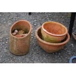 Four Terracotta pots.