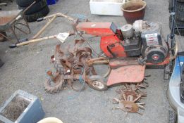 A Merry Tiller rotavator with attachments,