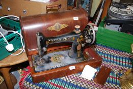 A wooden cased hand Singer sewing machine F7984963.