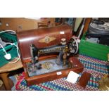 A wooden cased hand Singer sewing machine F7984963.