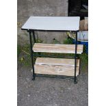 Enamel topped table with two shelves, 23'' x 14'' x 31'' high.