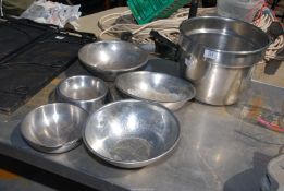 Seven stainless steel bowls including one large size.