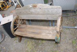 A garden bench with wheel effect ends, 42'' wide x 32'' high.