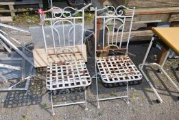 Two metal garden chairs.