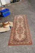 A 'Royal Khan' carpet runner, brown/beige/black, 99" long x 31" wide, and a Christmas tree stand.
