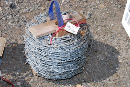 A large roll of barbed wire.